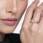 Estele Gold Plated Broad Band Intricate Design White Stone Ring